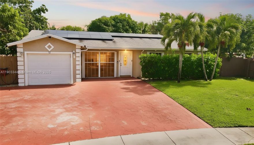 This beautiful single-family home sits on a spacious, oversized Lot with no HOA. The long concrete driveway provides ample parking, with enough space for two boats. The home features several recent updates, including a new roof, a new A/C system, and newer windows with accordion shutters, ensuring durability and peace of mind. Energy-efficient solar panels help reduce utility costs. Inside, you'll find elegant bamboo flooring throughout the remodeled interior. The kitchen is equipped with granite countertops and wood cabinets, and the baths has been updated. The huge backyard is a private oasis with various fruit trees, storage sheds, a fishpond, and a wooden deck overlooking the canal. This move-in-ready home offers a beautiful neighborhood and just waiting for your personal touch.