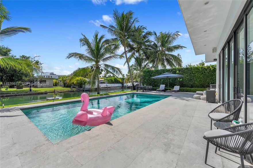 Located on the exclusive gated island of Biscayne Point, this modern waterfront residence blends timeless design with turnkey convenience. Rebuilt in 2014, the home features updated roof, impact windows and doors, plumbing, electrical, and A/C systems.

Offering 5 bedrooms and 3.5 bathrooms, the residence showcases high ceilings, limestone floors throughout, and a sleek gourmet kitchen with top-of-the-line appliances and generous storage. Designed for both comfort and entertaining, the property includes an oversized pool and a fully fenced lot with electric gates and circular driveway.

Enjoy the privacy of island living while being just minutes from top schools, beaches, restaurants, golf, tennis, and houses of worship.
