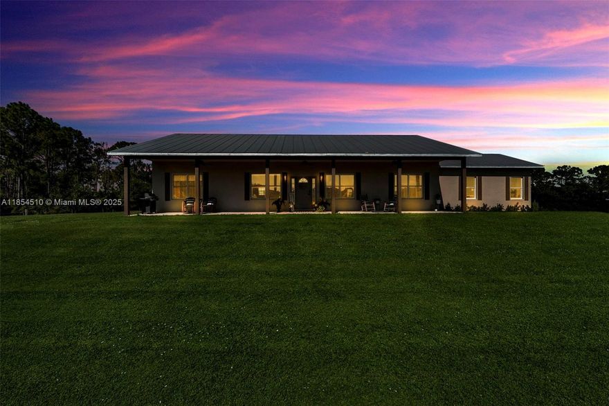 Set on 10.74 acres of lush woods and open pasture, this private retreat offers a rare blend of tranquility and modern comfort just minutes from town. The home features an open floor plan with high ceilings, tile flooring, and abundant natural light. A sleek kitchen with granite countertops, stainless steel appliances, and ample cabinetry makes entertaining easy. Outside, the fully fenced land is ideal for livestock, gardening, or recreation—perfect for a hobby farm or peaceful getaway. With endless potential to expand or enjoy as-is, this inviting property is a true Southwest Florida gem.