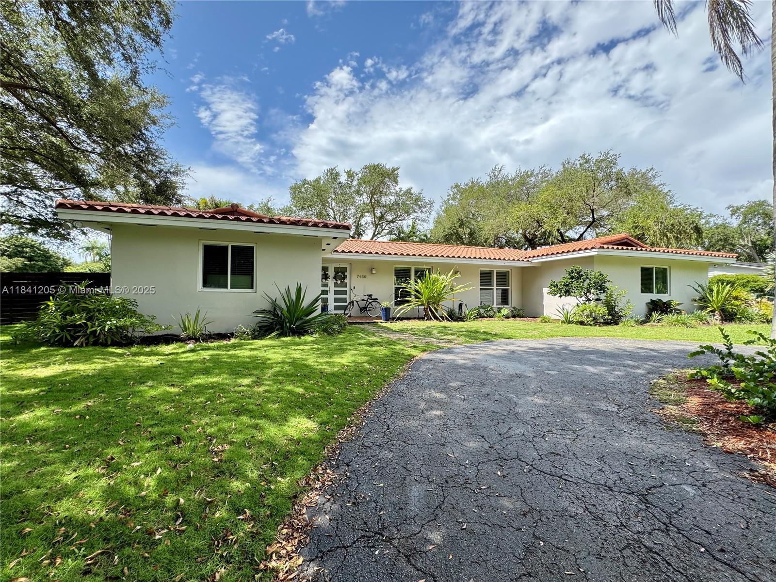 Beautiful home in desirable Palmetto Bay area off of Old Cutler, minutes from the bay, Deering Estate, parks, and top restaurants. Located in a friendly, active neighborhood with no mandatory HOA—enjoy block parties, holiday gatherings, and happy hours. This well-maintained home features a brand-new patio roof, newly screened pool enclosure, and a spacious yard with mature oak trees. Inside, enjoy custom front doors, crown molding throughout, and an open kitchen with granite countertops, wood cabinets, and stainless steel appliances. The home includes walk-in closets in the master and guest rooms, impact windows and doors, a new A/C unit, updated electric panel with full electrical upgrade, EV charging setup, and a new sprinkler system. Move-in ready with modern comfort and style!