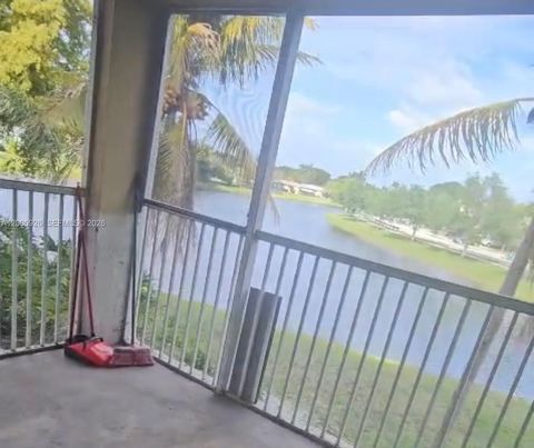 Photo of 5654 Rock Island Rd #227, Tamarac, FL 33319 (MLS # A12000926)