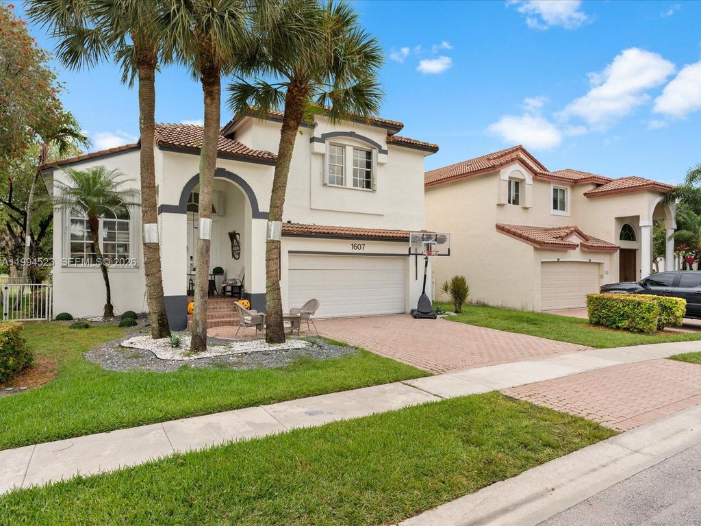 Photo of 1607 SW 157th Ave, Pembroke Pines, FL 33027 (MLS # A11994523)