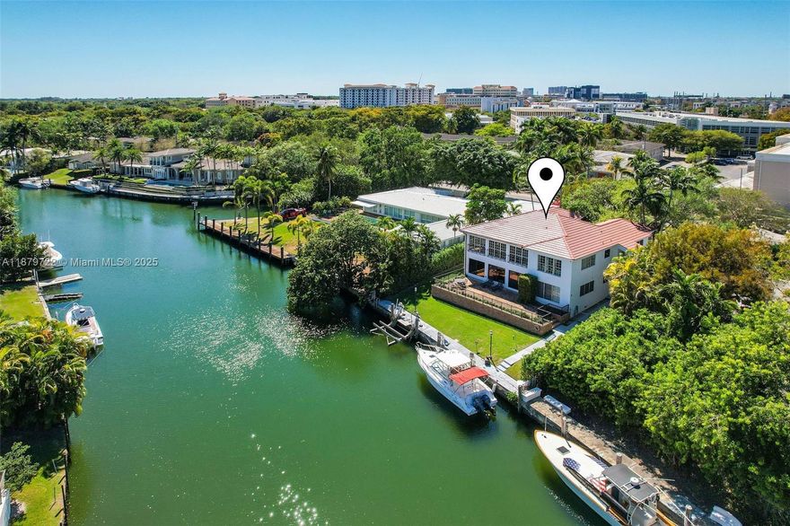 Unique waterfront opportunity! Two folios (03-41-30-016-0061 & 03-41-30-016-0062) combine to create a 4,072 SF property with an 80’ dock and just three fixed bridges to Biscayne Bay—a true boater’s paradise. Currently zoned as condominium, the property is offered as one sale. Each residence features 2BR/2.5BA, kitchen, family room, dining and living rooms, sunroom, ensuite bedrooms, exceptional interior storage, laundry room, exterior storage, and 3 parking spaces. Recent updates include a 2025 roof and renovations in neutral tones. With the proper governmental approvals, the property may present potential for conversion into a single-family home. Upstairs unit currently rented. Please do not disturb the tenants. Easy to show.