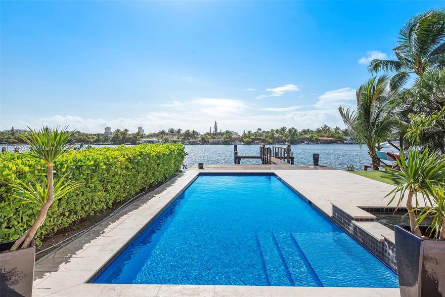 Rarely available Surfside waterfront home! Located in coveted 33154 zip code. Enjoy Island life while you plan your dream home in this 4 bedrooms 2 and 1/2 bath tropical paradise. Located on the wide water this gem has has a luxurious backyard with beautiful pool, marine grade lighting and a sunset deck. The home has marble floors throughout, wood floors on the bedrooms, a large walk- in closet a modern open kitchen, indoor and outdoor bars and a covered patio. Enjoy a relaxed lifestyle removed from city life. Steps from the beach, The Surf Club Four Seasons and world-renowned shopping and restaurants at Bal Harbour Shops. As per owner total living area is 2,400. The safest neighborhood with great schools and walking distance places of worship!