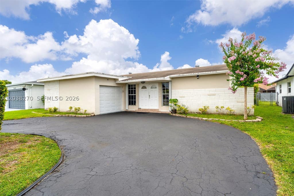 Photo of 9624 NW 19th Pl, Sunrise, FL 33322 (MLS # A12038270)