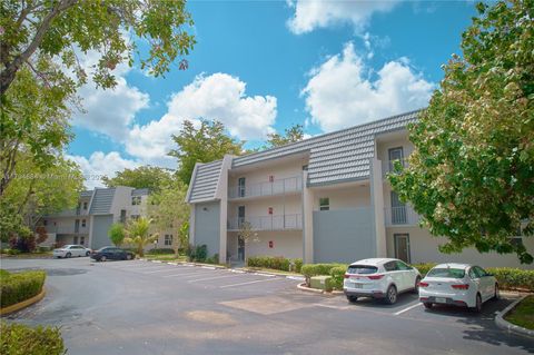 Photo of 9150 Lime Bay Blvd #201, Tamarac, FL 33321 (MLS # A11794884)