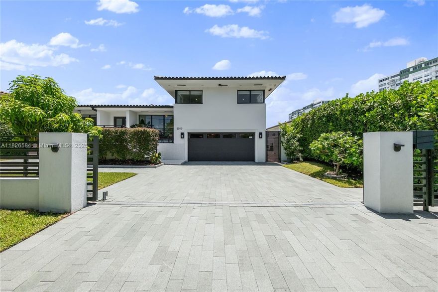 Welcome to your dream home in the exclusive Sans Souci Estates subdivision. This beautifully renovated 4-bedroom, 4-bath residence offers 75 feet of prime water frontage with no fixed bridges to the bay—perfect for boaters and water enthusiasts. Step inside to a bright, open-concept layout featuring thoughtful high-end finishes, custom kitchen, spacious bedrooms, and impact glass throughout. Outside, enjoy your own tropical oasis with a spacious patio, travertine summer kitchen, and private dock, ideal for family gatherings and entertaining. Just minutes away from Haulover Inlet, you're never far from the open ocean. This turnkey home is more than just a place to live—it's a lifestyle. Come experience the best of waterfront living in one of North Miami’s most desirable neighborhoods.