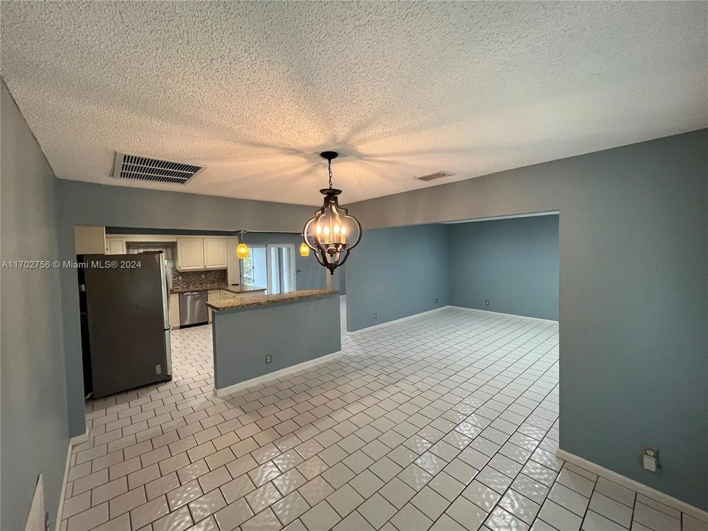 Photo of 11291 NW 39th Ct, Coral Springs, FL 33065 (MLS # A11702756)