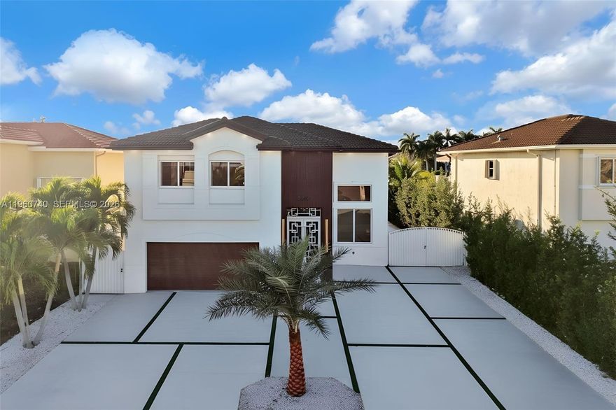 Fully remodeled lakefront home featuring 5 bedrooms, 3 full bathrooms, and 2,595 sq ft of living area. One bedroom with a full bathroom is conveniently located on the first floor. Built in 2006, the home offers a new modern kitchen with brand-new appliances, a new water heater, impact windows, and high ceilings throughout. Ceramic tile flooring on the first floor and laminate flooring on the second floor enhance its modern appeal. The primary suite and other bedroom includes a private terrace with stunning lake views. No HOA. The 6,000 sq ft lot provides ample outdoor space with room for a boat and new construction pool. Two-car garage. Prime location near top-rated schools, shopping, and dining. Move-in ready waterfront property.