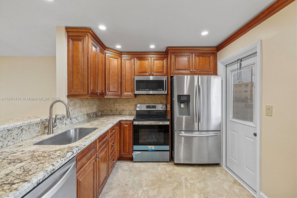 Photo of 219 NE 14th Ave #101, Hallandale Beach, FL 33009 (MLS # A11831431)