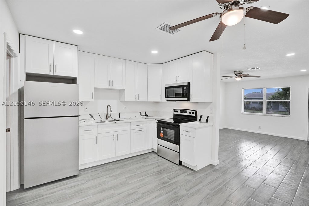 Photo of 5900 NW 19th St #B, Sunrise, FL 33313 (MLS # A12059146)