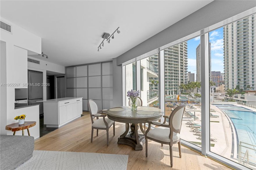 Residence 1201 at Mint Condominium offers a rare opportunity to live in Brickell’s only gated riverfront community.
This sun-filled 3-bedroom, 3-bath residence spans 1,544 square feet and showcases panoramic views of the Miami River and city skyline from two oversized private balconies. The interior has been recently refreshed and features wood flooring throughout, custom built-in closets, and motorized blackout window treatments, creating a comfortable and refined living environment. High-speed internet service and one assigned parking space. Mint Condominium provides an extensive collection of resort-style amenities, including a heated lap pool, jacuzzi, sauna, steam room, full-service fitness center, yoga studio, co-ed spa, and a children’s playroom. Conveniently positioned with direct access to I-95, the location allows for effortless commuting while remaining moments from Brickell’s dining, shopping, and entertainment destinations.