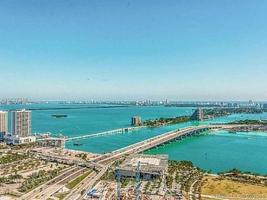 LIGHT & BRIGHT High-End Finishes! Hi-floor small 2 Bed/2 Bath w spectacular Biscayne Bay Water Views. 10' Ceilings. White Glass floors thruout. Laminated White Glass Rolling Walls separate bedrooms to Common Areas. Open Floorplan w/ White Lacquer Italian  Kitchen,SS Miele appliances & Sub-Zero Ref. Gorgeous Custom White Oak Wood Closets. Designed by infamous Sam Robin w/5 Star amenities-2 Pools, Coconut Palm Garden, Fitness Center w/Decleor Spa, Private Theater, Childrens Playroom & Resident's Club Lounge