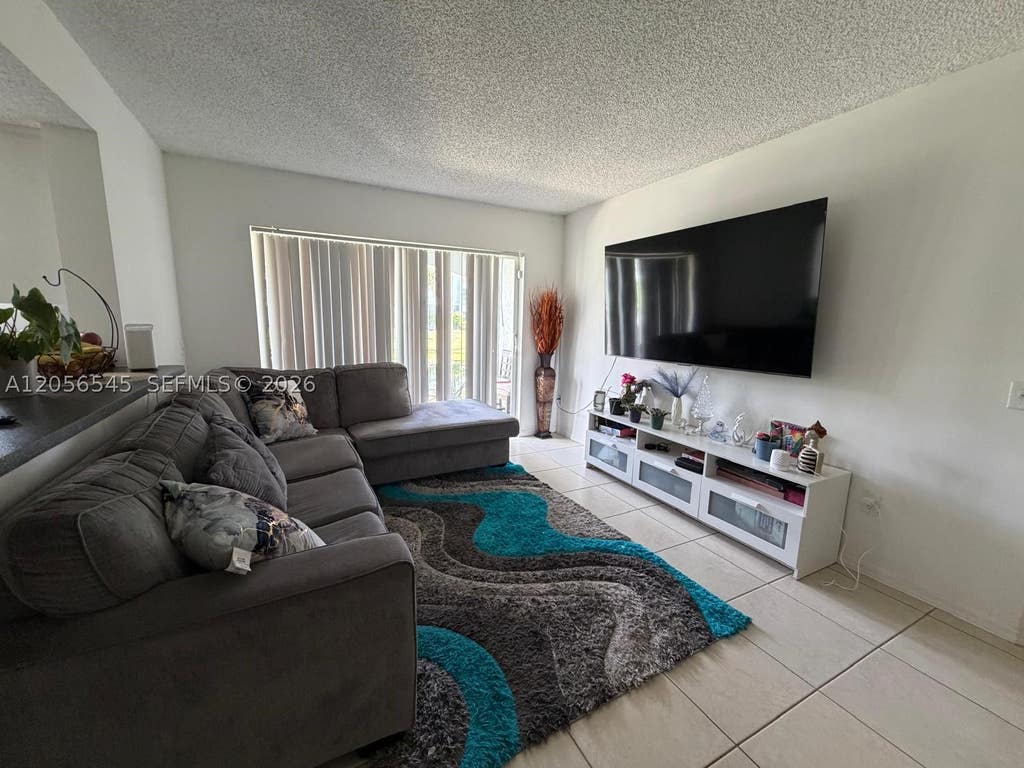 Photo of 9645 NW 1st Ct #1-110, Pembroke Pines, FL 33024 (MLS # A12056545)