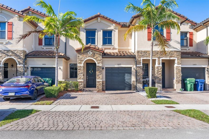 Beautiful 3-bedroom, 2.5-bath townhome with bright open layout and tile flooring throughout—no carpet. Spacious kitchen features granite countertops, stainless steel appliances, and a large breakfast bar. Large primary suite includes a very spacious walk-in closet and dual-sink vanity with glass-enclosed shower. Enjoy a private fenced patio with covered pergola, garage and private driveway parking. Conveniently located near the Florida Turnpike, Exit 6, major supermarkets, shopping, and dining. Move-in ready and ideal for first-time buyers or investors.