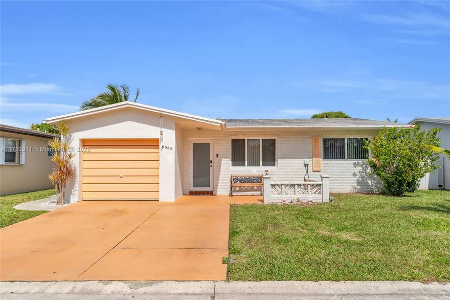 ***Approved Short Sale***. This spacious 2-bed, 2-bath single-family home is just 2 blocks from the clubhouse in a desirable 55+ community with low HOA fees. The newly renovated Florida room features hurricane impact doors. The large living room offers plenty of space for relaxation. The kitchen boasts stainless steel appliances, a new dishwasher,  new garbage disposal, a breakfast counter, an oven, a microwave, and a pantry. A dining area, utility room with a full-size washer and dryer, and a one-car garage add convenience. The two-car cement driveway provides ample parking. A newer air conditioner and ductwork were installed in June 2021, along with an updated electrical panel. The backyard features banana and frangipani trees, creating a serene outdoor space.