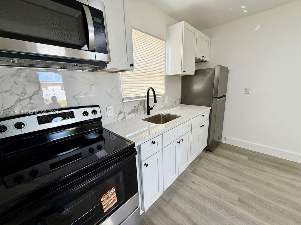 Photo of 1845 Dixieanna St #1, Hollywood, FL 33020 (MLS # A11948115)