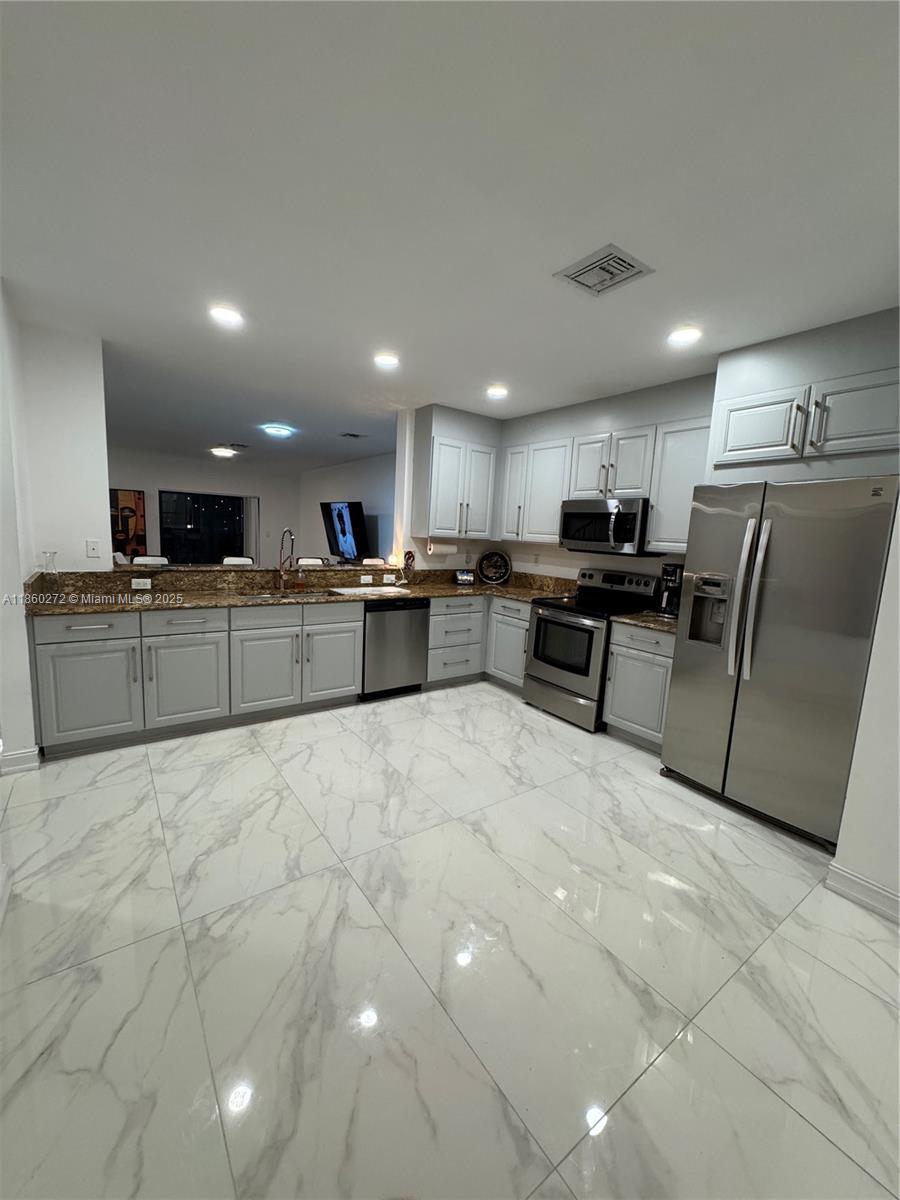 Fully Remodeled Waterfront Townhome with Private Dock.
Live the ultimate South Florida lifestyle in this fully luxuriously remodeled townhome, a gated waterfront community with direct ocean access, including a deeded dock slip with full power, accommodating boats up to 34’. Inside, enjoy a modern, open-concept design with a spacious chef’s kitchen featuring SS appliances, plus a dining/living area that flows to a private patio perfect for entertaining. Upstairs offers 3 bedrooms, including a large primary suite with dual closets, double vanities, Roman tub, and separate shower. The home is newly upgraded with premium flooring & fresh interiors. Community amenities include a pool, gym, and private marina. Ideally located minutes from Fort Lauderdale Airport, beaches, dining, and nightlife.