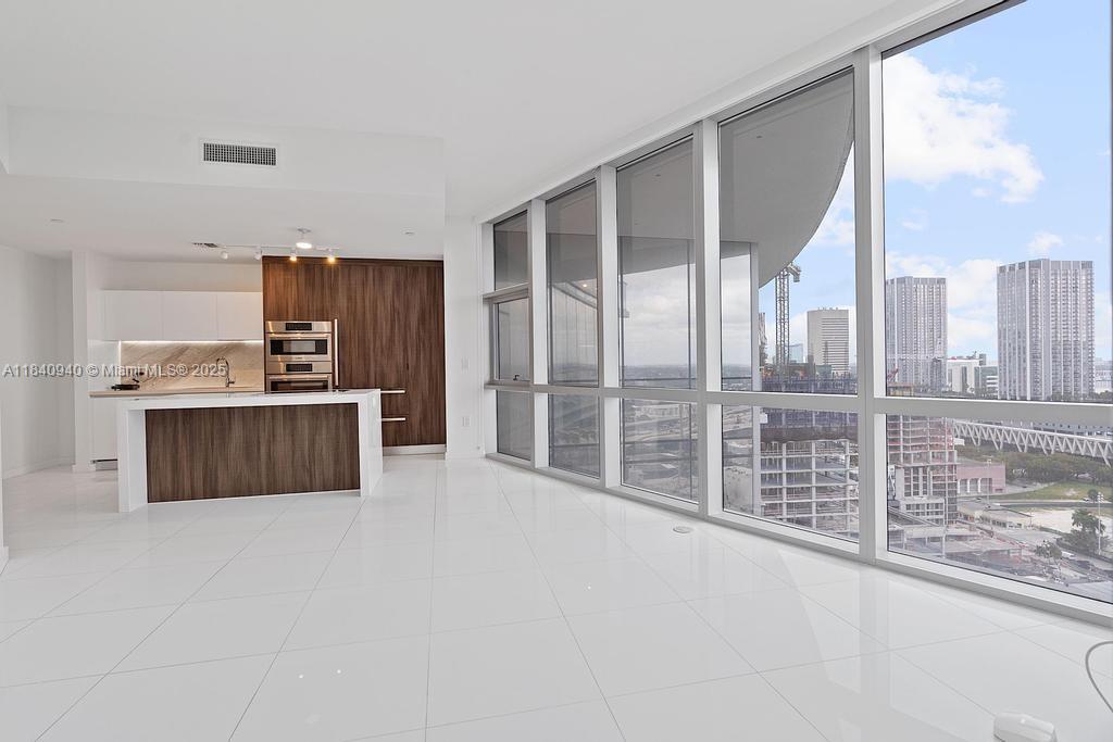 Hi-quality Spanish blinds installed! Built-in closets installed for the new owners' benefit! WiFi+TV included. Bathtub with glass sliding door. 1 Bed + DEN /2 Baths @ PARAMOUNT MIAMI WORLD CENTER. PRIVATE Elevator to Unit, White ceramic floors throughout, balcony with tile, Sunset views of Miami, 2 Car spots (1 Valet & 1 Assigned spot), Internet and Cable included. Steps away from Brightline Train Station, AA Arena, Bayside, Museums, Etc. The building was nominated for the Most Amenities in the World, featuring a basketball court, 5 pools, a Spa, a Gym with a boxing area, BBQ kitchen, Virtual Golf, a Recording Studio, Racquetball, a Yoga Studio, and a kids' Play Area. City Observatory to view stars with telescopes, Tennis courts, Jacuzzi, 53rd floor overlooking the city.