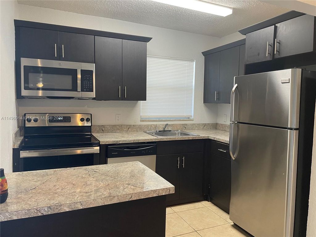 Photo of 400 NW 65th Ave #214, Margate, FL 33063 (MLS # A11496014)