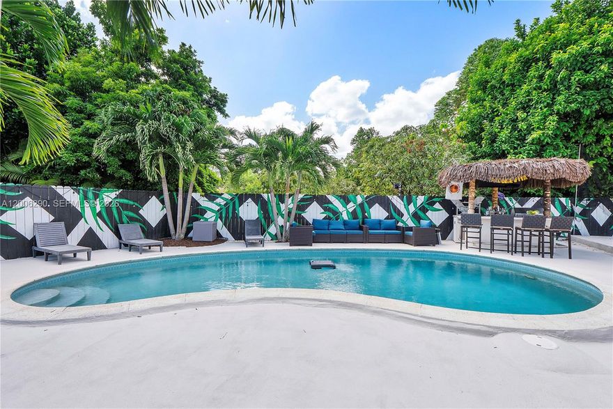 Just listed! This fully renovated home in an up-and-coming neighborhood features a 2025 roof, new flooring throughout, upgraded plumbing and electrical, and beautifully renovated bathrooms. The backyard is an entertainer’s dream with a pool, sand volleyball court, and a tiki bar complete with wine cooler, fridge, BBQ, and music system. Top-of-the-line appliances, space for 10+ cars, and a prime location just minutes from Publix, I-95, and Jackson Memorial Hospital North make this home truly move-in ready and perfect for both comfortable living and entertaining. You have 5 ways to get to the house, most of them 4-5 mins from I 95 highway.