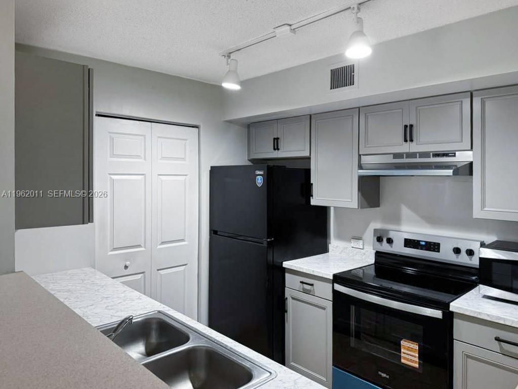 Photo of 11133 SW 8th St #104, Pembroke Pines, FL 33025 (MLS # A11962011)