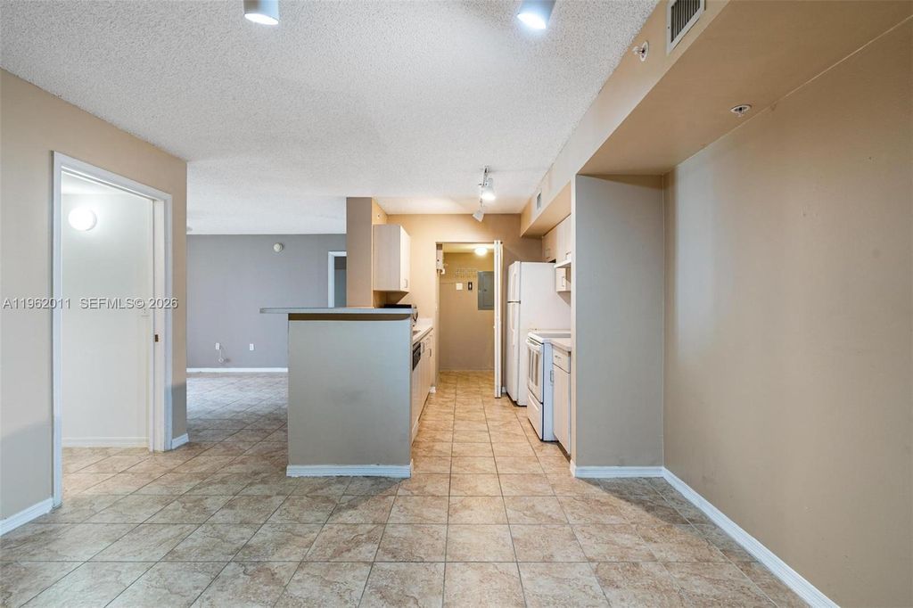 Photo of 11133 SW 8th St #104, Pembroke Pines, FL 33025 (MLS # A11962011)