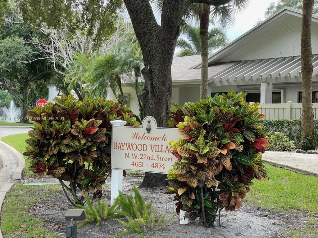 2/2.5 Townhome available in the Township - Baywood Village II. Centrally located. Renovated kitchen with farmhouse sink, stainless appliances and all wood cabinets. Huge granite breakfast bar. Separate dining area with lake view. New roof, skylights and exterior paint. New ac - March 2020, accordion shutters, storage under stairs with ext. storage. Open concept living/dining area, 2 large en suite bedrooms upstairs with lg. closet and w/in closet. Lake view from rear bedroom.
