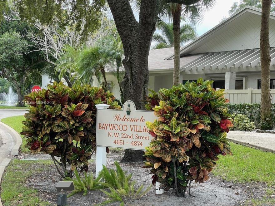 2/2.5 Townhome available in the Township - Baywood Village II. Centrally located. Renovated kitchen with farmhouse sink, stainless appliances and all wood cabinets. Huge granite breakfast bar. Separate dining area with lake view. New roof, skylights and exterior paint. New ac - March 2020, accordion shutters, storage under stairs with ext. storage. Open concept living/dining area, 2 large en suite bedrooms upstairs with lg. closet and w/in closet. Lake view from rear bedroom.