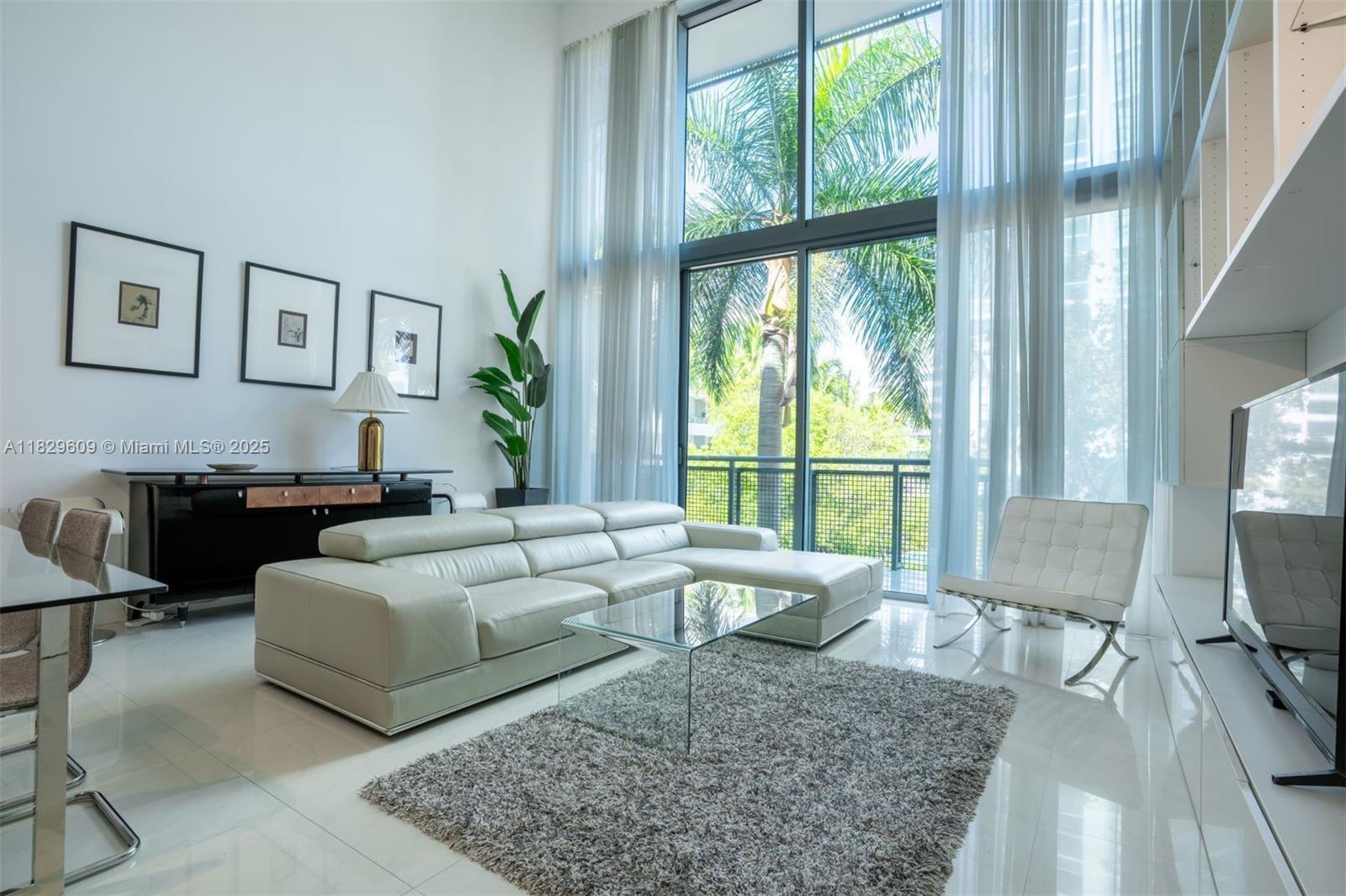 Experience elevated loft-style living near Miami's famed Millionaires Row. This fully furnished, two-story residence spans 1,700 SF with 2 bedrooms, 2 bathrooms, and a versatile loft/den. Soaring 18-foot ceilings, porcelain tile floors, and a sleek European kitchen with high-end Miele appliances create a modern, light-filled space. Offered fully furnished for an annual lease, the unit includes built-in storage, a fully stocked kitchen, and one assigned parking space. Rent includes a $75 monthly FPL allowance, high-speed internet, and all other utilities. Located in Terra Beachside, enjoy a heated pool, Jacuzzi, health club, lounge, and 24-hour security. Across the street from public beach access, Starbucks, and minutes to dining, shopping, and more.