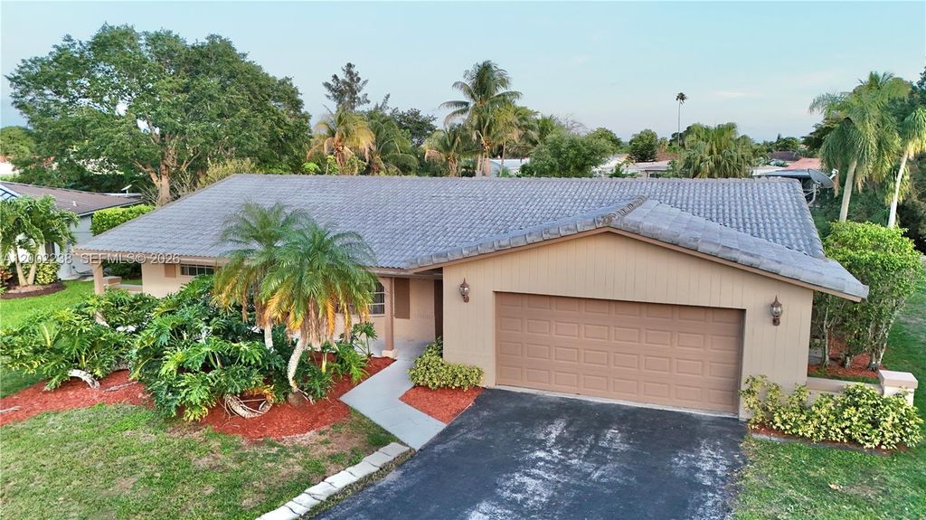Photo of 10930 NW 41st Dr, Coral Springs, FL 33065 (MLS # A12002238)