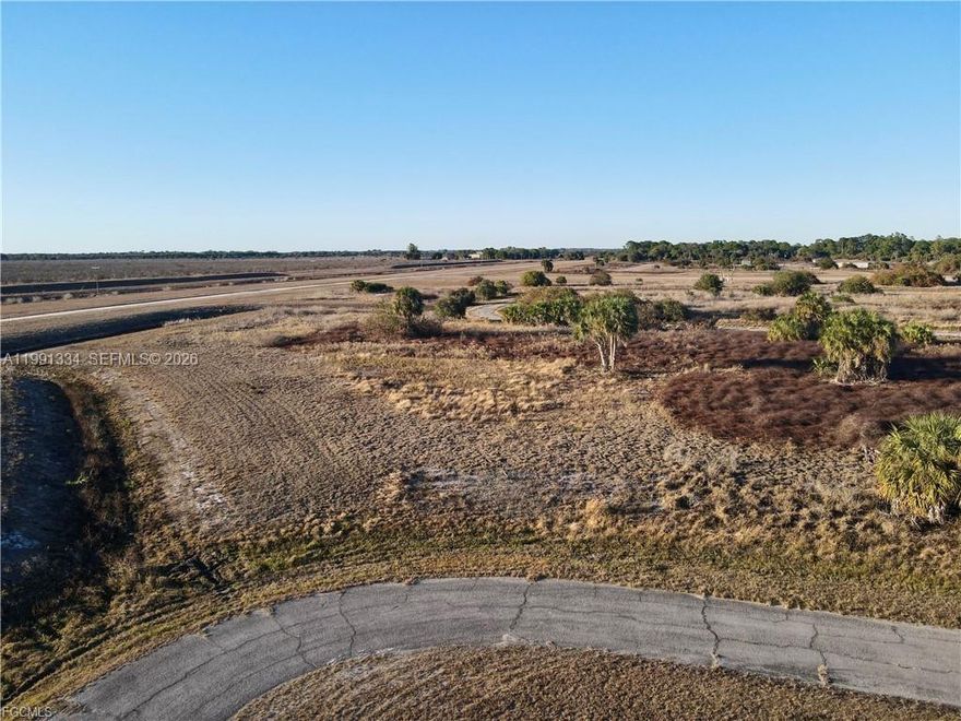 Build your dream home on this beautiful 0.45-acre vacant lot located in Port LaBelle, FL. This spacious property offers plenty of room for a custom home, workshop, or additional outdoor space. The lot already has power poles nearby, making future development more convenient. Located between LaBelle and Clewiston, this property offers the perfect balance of accessibility and peaceful country living. Situated in the county (not within city limits), you’ll enjoy a quiet, private setting with fewer restrictions and a relaxed rural atmosphere. If you’re looking for peace and quiet, this is the perfect place to build. Don’t miss this opportunity to own nearly half an acre in a growing area of Hendry County.