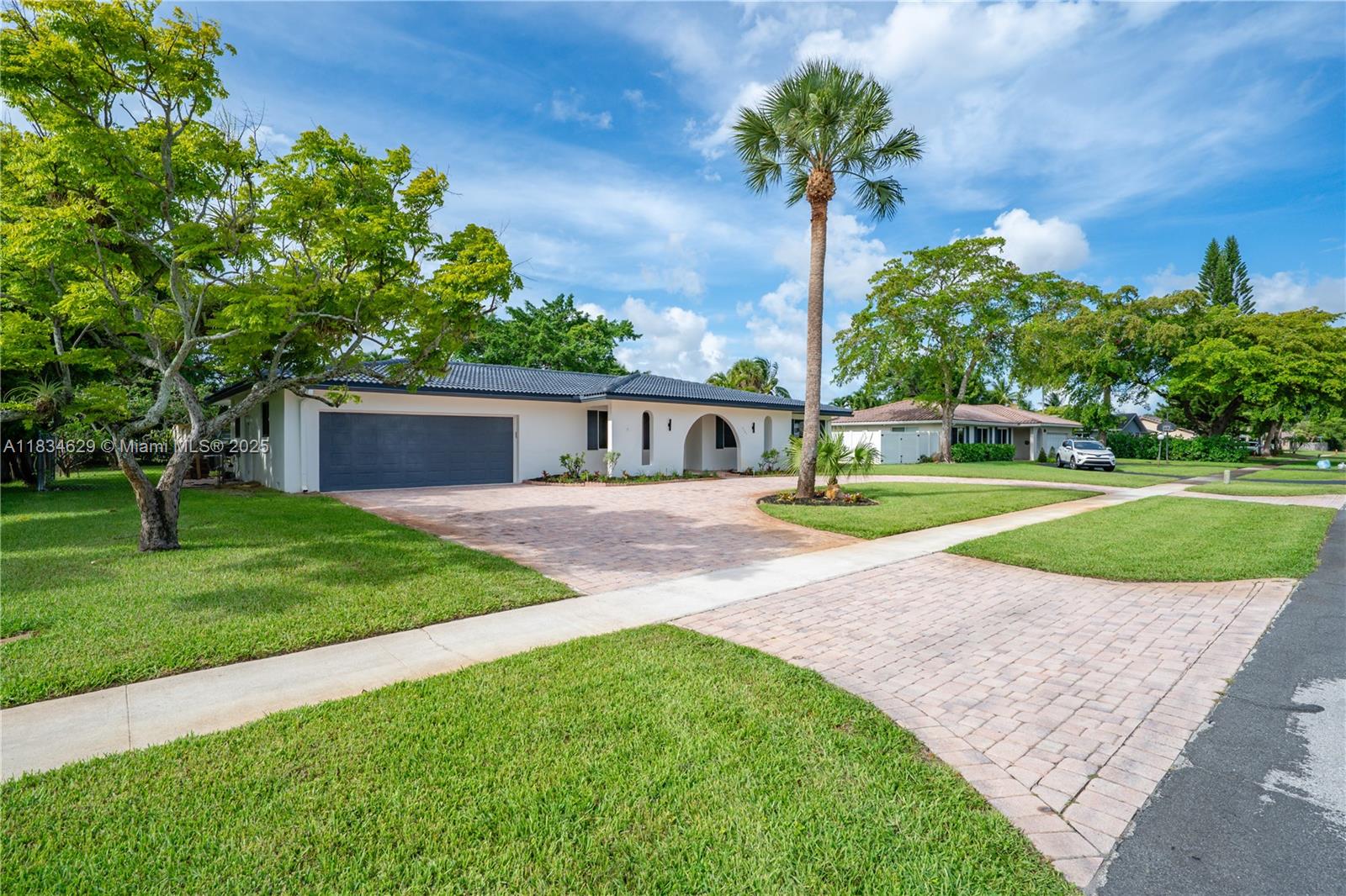 Beautifully renovated, this spacious 5 bedroom, 3.5 bath home is one of the largest in the area, offering generous living spaces, luxurious finishes and designer touches throughout. The large chef's kitchen seamlessly blends into the spacious living and dining area. One of the bedrooms, with en-suite bathroom, is thoughtfully separated, perfect for guests, in-laws or as an office. Enjoy the expansive backyard with an oversized pool, mature mango tree and plenty of space for outdoor entertaining. Located just steps from Plantation Heritage Park, this home offers the perfect combination of indoor comfort and outdoor enjoyment. New porcelain tile floors, kitchen, bathrooms, impact windows and electrical panel. Double garage. One pet allowed. Can be rented furnished with an additional fee.