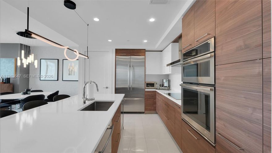 Absolute best downtown address in the heart of Ft.Lauderdale! Breathtaking views featuring 10 foot floor-to-celling windows. Split floor plan 2 bed /2.5baths + a large office/den; porcelain floor throughout, all windows feature motorised black out shades. Upgrades includes integrated home automation SONOS system for sound, TV & lighting. Kitchen equipped w Euro cabinetry, Jenn-Air stainless appliances & quartz countertops/backsplash, wine cooler. Bedrooms feature built-in custom closets. Unit sold fully furnished & turn-key! Parking ASSIGNED side by side space, one is which is /EV CHARGING SPACEI. Five-star resort-style amenities; rooftop pool, cabanas, fitness center, grills, club room, restaurants, 24hr doorman/security, valet service. Rapid HOA approval. Text Agent for showings