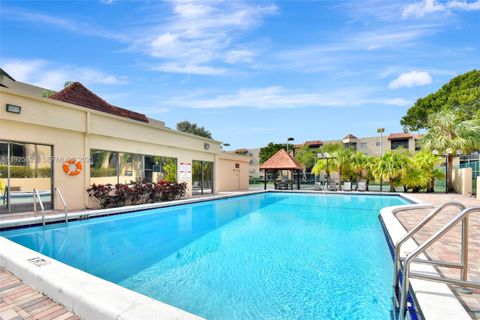 Photo of 10501 W Broward Blvd #304, Plantation, FL 33324 (MLS # A11925621)