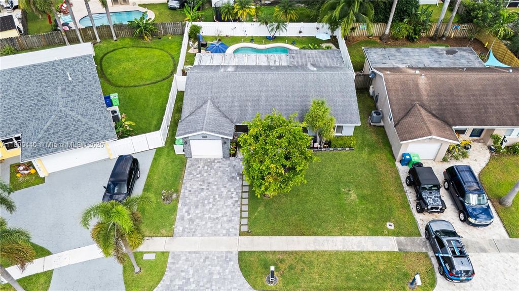 Photo of 11741 NW 43rd Pl, Sunrise, FL 33323 (MLS # A11895440)