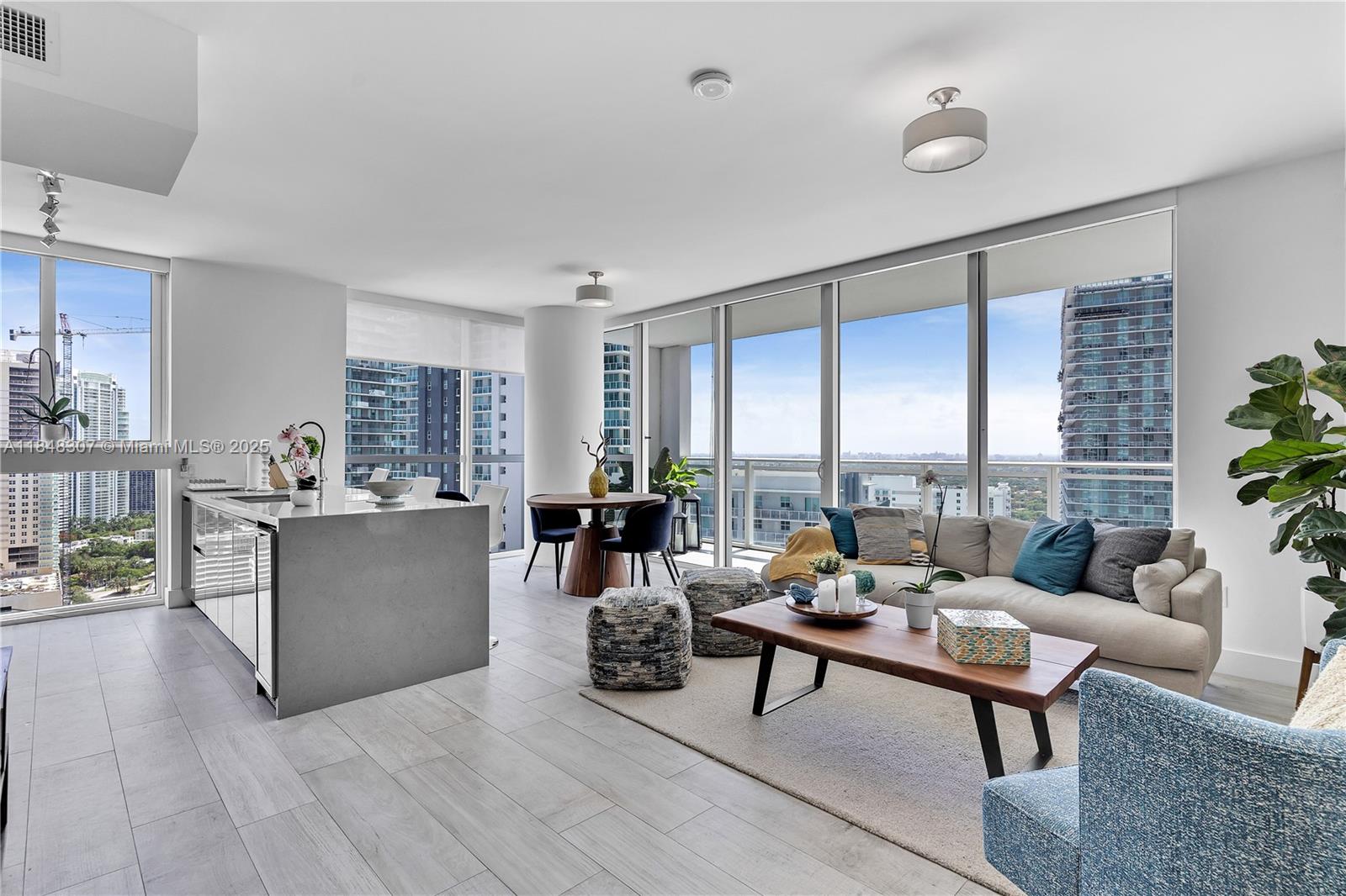 This modern furnished 2 bedrooms, 2 bathroom corner unit apartment located in the vibrant Brickell area offers stunning views of the sunset and Coral Gables. This unit boasts a split floor plan wit floor-to-ceiling windows, top-of-the-line Bosch appliances, a wine fridge, custom walk-in closets. The second bedroom can serve as a versatile space, perfect for use as an office or guest room. Beautiful British-inspired decor, top-notch amenities like a gym and pool, and convenient access to restaurants and shopping. The unit features high-end finishes, floor-to-ceiling windows, and a versatile second bedroom / home office. Ideal for those seeking luxury living in a vibrant urban setting. Tenant must acquire renter's insurance.