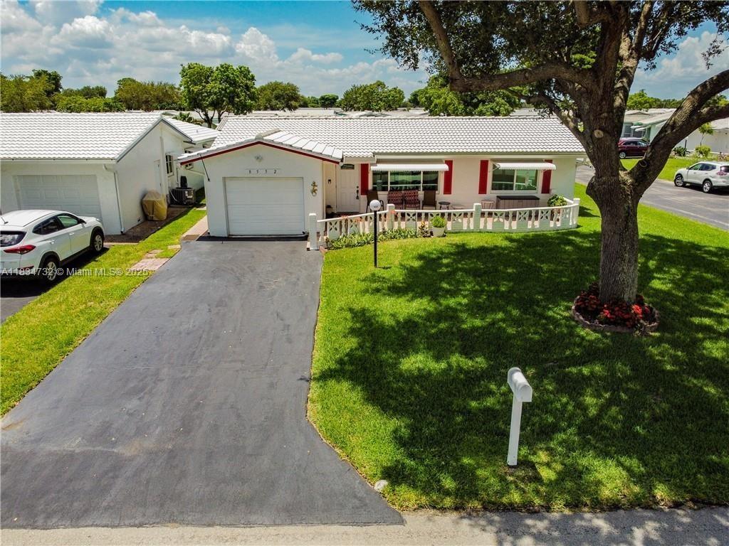 55+ community located on a corner lot. Newer impact windows, A/C, and gorgeous vinyl flooring throughout. Updated bathrooms with tile floors and a kitchen with all wood cabinets and quartz countertop, one car garage. A must-see with Stainless Steel Appliances. Titan instant tankless water heater. Enjoy the relaxed atmosphere of this neighborhood. The Club House, Library and Gym, Spa, Sauna and Showers close to the Salt Water Pool. HOA covers Roof, Exterior Paint, Termite, Lawn Care and Shuttle to local stores.