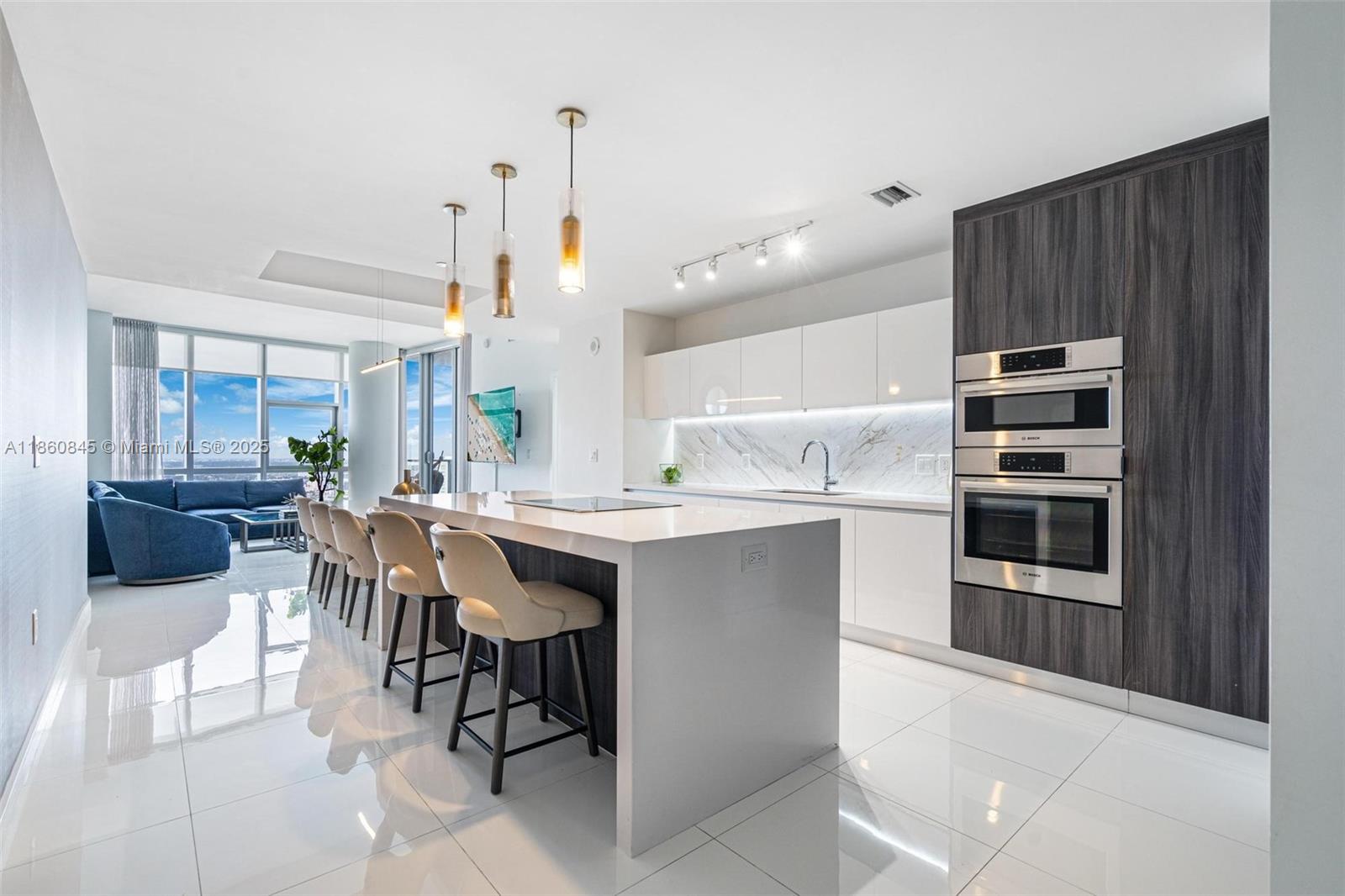 Welcome to Unit #3301 in the prestigious Paramount Miami Worldcenter, located in the heart of Downtown Miami. The residence spans 2,204 SF & boasts a private foyer, 3 BD's + den, & 4 bathrooms. With floor-to-ceiling windows throughout, enjoy skyline & partial bay views all from the comfort of your own home. The lavish primary suite has wraparound windows for endless panoramic views and also includes a large walk-in closet & spa-like bathroom with separate tub & shower. Paramount is known for their dazzling array of exclusive amenities, including 5 pools w/cabanas, 2 tennis courts, a state-of-the-art fitness center, yoga studio, spa, kids’ playground, BBQ area, business center, basketball court, and much more. Perfectly positioned in the heart of the brand-new Miami Worldcenter development.