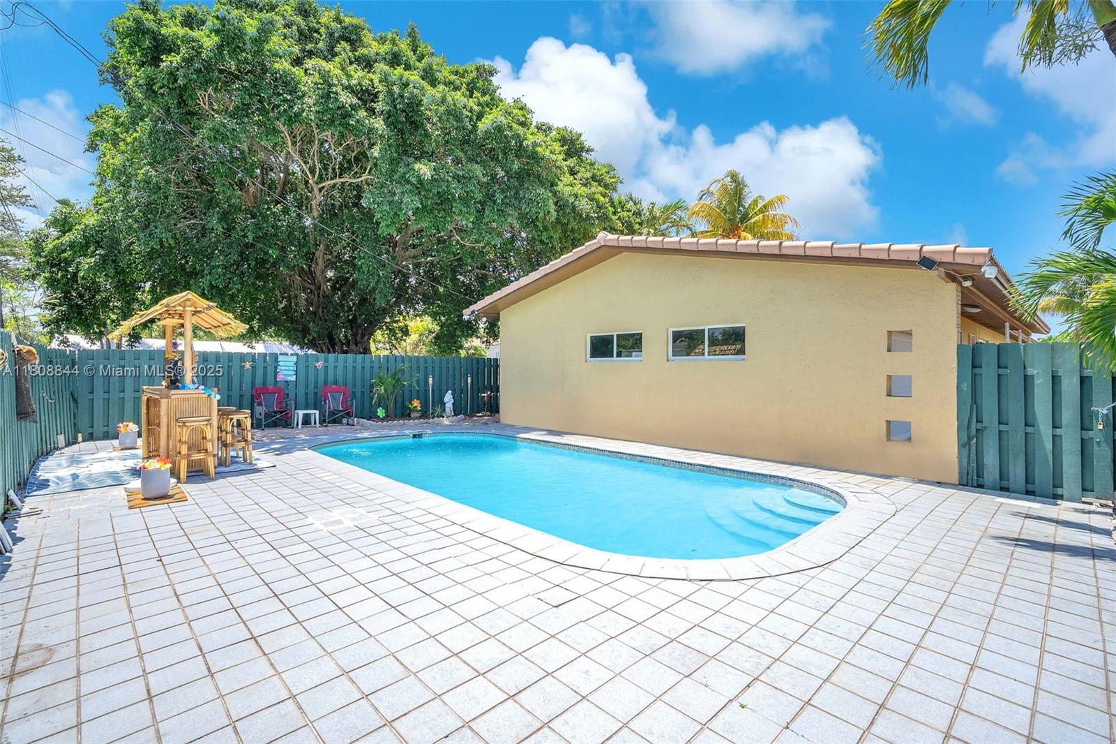 This beautifully maintained single-family, pool home with 2 car garage, is ideal for a large family. Boasting a smart & flexible floor plan, the home features a natural separation allowing one side to be easily closed off and converted into a private apartment—complete with its own entrance. Whether you're looking to collect rent to offset your mortgage or accommodate extended family in a private in-law suite, the layout offers outstanding adaptability. Best of all, the property is located within RM-9 zoning, which permits legal conversion into a duplex, making this a rare and valuable opportunity for long-term income growth or multi-family living. Minutes from downtown Hollywood, the beach, shopping, & major highways. 1520 N 25 Ave is the perfect blend of lifestyle & investment potential.