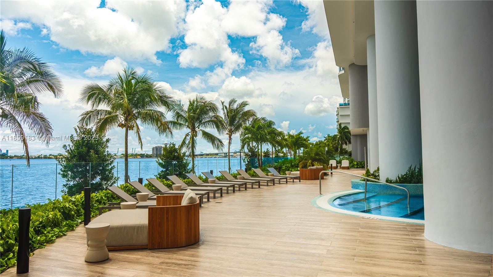Brand-new 2025 luxury 3BR + den, 3.5BA with 1,750 SF + 229 SF terrace offering direct water views. Upgraded unit with custom closets & 2 assigned parking spaces. Enjoy 2 acres of resort-style amenities: private sports marina, 3 pools, spa, fitness center, wine lounge, kids’ play area, library, tennis, paddleball, basketball, mini golf & more. Prime location near Design District, Midtown, Brickell & MIA Airport.