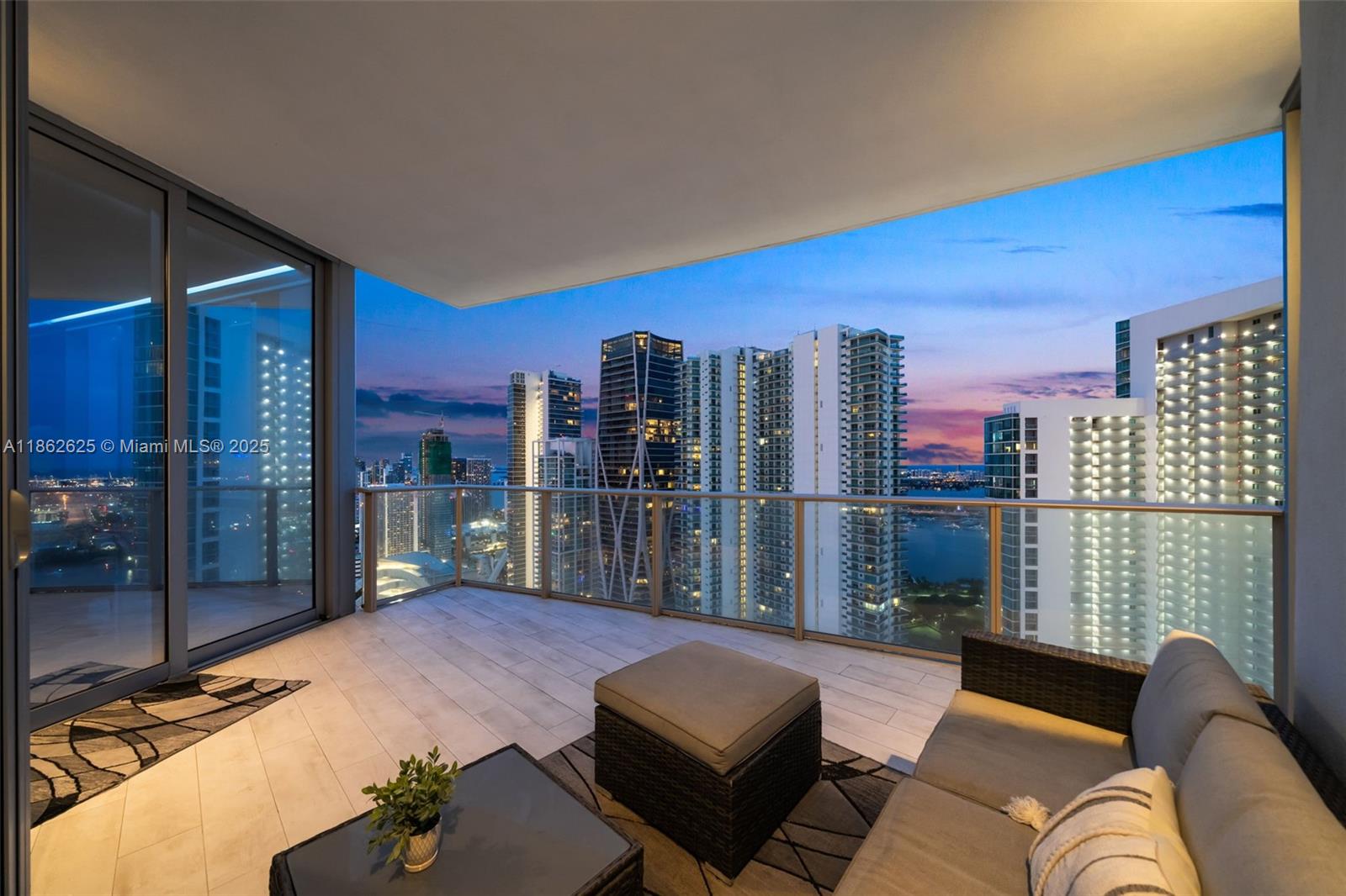 Resort-style residence at Paramount Miami Worldcenter, the most amenity-rich building in Miami. This high-floor unit offers 2BD+ den, 3BA, and a spacious 1,753 sq.ft. interior/1,952 sq.ft. total (per builder). The private elevator foyer welcomes you into a sleek home with 10ft. floor-to-ceiling impact glass, and panoramic views of the bay, intracoastal, & skyline. Upgrades include a custom wall fireplace, LED lighting throughout, upgraded fixtures, and a designer custom paint job, elevating the home’s elegance. The European kitchen features custom cabinetry, a waterfall-edge island, & top-of-the-line appliances, flowing seamlessly into the open living & dining area. Paramount delivers a true resort lifestyle with multiple pools, full-service spa, fitness center, sports courts, & more.