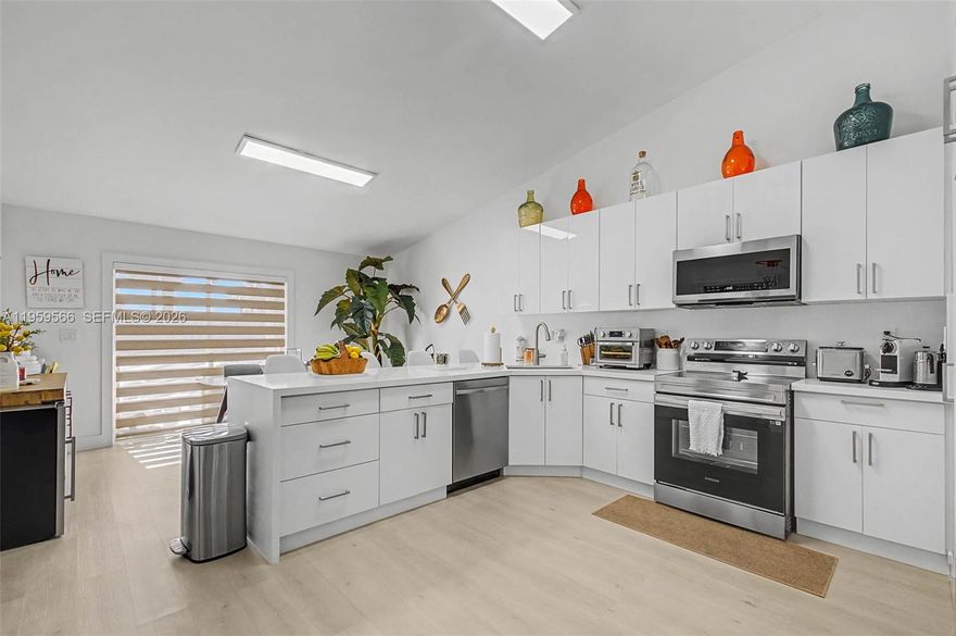 Hurry—this one is a beauty! Recently and tastefully renovated, this classy 2-bedroom, 2-bath one-story villa is located in the desirable Villas at Deerwood community near Zoo Miami. No detail was spared in this modern renovated villa, offering style, comfort, and convenience in every space. Just minutes from the Florida Turnpike and major highways, the location provides easy access to shopping, dining, and everyday essentials. This impeccably-maintained home features an inviting layout with vaulted ceilings that enhance the sense of space and natural light, all-tile flooring throughout, and a sleek kitchen with generous counter space and abundant cabinetry—perfect for cooking and entertaining. The kitchen also includes newer stainless steel appliances, combining functionality with modern design. Enjoy peaceful mornings or relaxing evenings on the cozy front porch. The low-maintenance backyard offers ample space for outdoor seating or casual entertaining and includes a convenient storage closet. Move-in ready and lovingly maintained, this villa is a wonderful opportunity to enjoy modern living in a prime location. Low HOA includes roof, exterior paint, and insurance, adding exceptional value and peace of mind. Community amenities also include a pool, tennis courts, security, and a children’s playground—everything you need for relaxed South Florida living. Hurry call listing agent today.