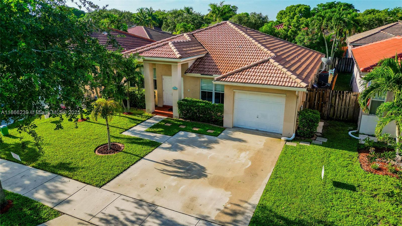 Located in the gated community of Poinciana Parc, this 3-bedroom, 2-bath home has been built and well maintained by the original owner. The open floor plan includes a sitting room, formal dining room, and separate living room, all with high ceilings and a bright interior. Recent updates include a 2021 A/C system and tankless water heater. The exterior features a private POOL and fenced backyard. Gated Community with a 24-hour guarded entrance, proximity to I-75, I-595, Davie schools, and Sawgrass Mills. HOA covers front lawn maintenance.