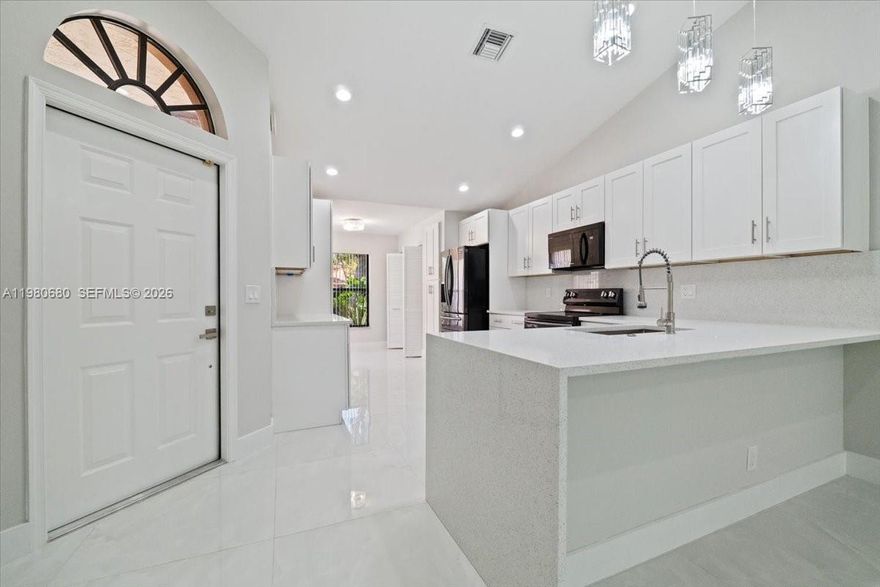 Discover redefined luxury in this fully remodeled 2-bedroom, 2-bath residence in the heart of Boca Raton. Every detail is crafted for comfort and sophistication: an open kitchen with an island, breakfast nook, stainless steel appliances, and gleaming porcelain tile floors. A bright sunroom opens to a screened patio, perfect for relaxing outdoors. The spacious primary suite features a large walk-in closet and a spa-inspired bath with a luxurious soaking tub, glass shower, and dual sinks. The home also includes a garage, ensuring convenience and security. Nestled in a gated community just minutes from beaches, upscale shopping, and fine dining, this is the epitome of a sophisticated lifestyle. Don’t miss this rare opportunity.