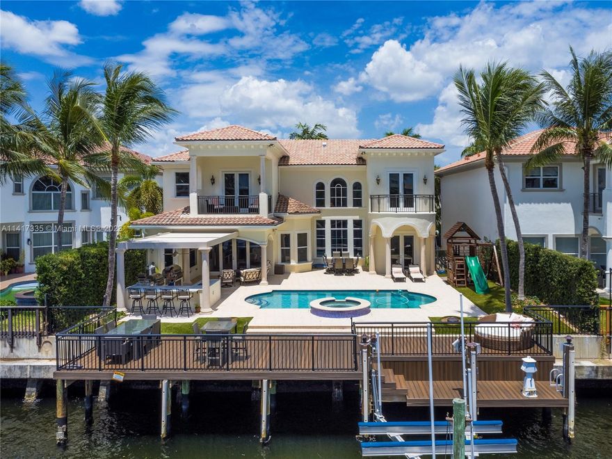 Stunning two-story waterfront home located in the Estates of Harbor Islands! Featuring 5 beds, 5 full bath, 2 half baths, office/den/playroom & brand new movie theater. Chef's kitchen equipped with SS appliances, two ovens, gas stove, quartz countertops & big pantry. Open layout connects the kitchen to the living room, family room & formal dining room. Volume ceilings, impact windows & doors. Large master suite with private balcony overlooking the intercostal, custom closets, jacuzzi tub & double sinks. Spectacular outdoor space with a brand new summer kitchen, brand new extended dock, pool with jacuzzi & dock for your vessel. Deep water, no fixed bridges, easy ocean access. Community offers an array of amenities: marina, clubhouse, parks, tennis/basketball courts, security & gym and more.