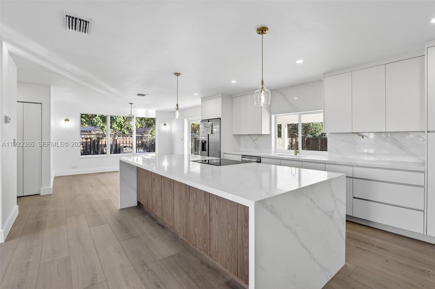 Welcome to this beautifully remodeled 4-bedroom, 2-bath home designed for effortless living and entertaining. The sun-filled open-concept living area offers a seamless flow, creating a warm and inviting space perfect for both everyday moments and hosting guests. The kitchen is the heart of the home, featuring a striking waterfall island, quartz countertops, and a spacious pantry closet for added functionality.
Each bedroom offers comfort and privacy, with walk-in closets providing generous storage throughout. A roof replaced just 3 years ago adds peace of mind, while the expansive patio area invites you to relax, entertain, or envision a future pool. The owner, a licensed general contractor, can provide pool estimates and construction options, offering a rare opportunity to personalize your outdoor oasis. A move-in-ready home that blends style, comfort, and possibility.