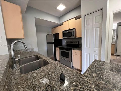 Photo of 2400 Centergate Dr #102, Miramar, FL 33025 (MLS # A11884243)
