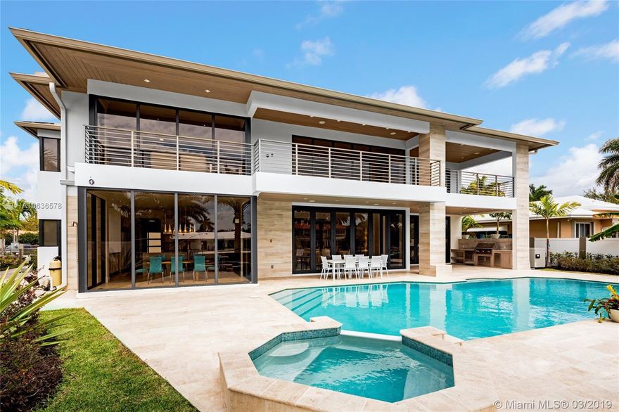Inspiring brand new construction waterfront home in the desirable Coral Ridge neighborhood. The entrance greets you with 22 ft ceilings a modern flow-through design and a gallery bridge overhead. Featuring 5,600 sq ft of living space, 5 beds/5 baths, 2 laundry rooms, private elevator, 2 master bedrooms located on the first & second floor, Chef&#x2019;s kitchen, butler pantry, 3 car garage with glass doors, outdoor summer kitchen, accordion impact glass sliding doors, roofed terraces, heated pool with spa, & one of the only homes in the area with natural gas. This home offers unparalleled finishes & impressive architecture ranging from custom champagne colored roof metal to real cypress soffits, made for any buyer looking for the perfect combination of high-end finishes with contemporary design.
