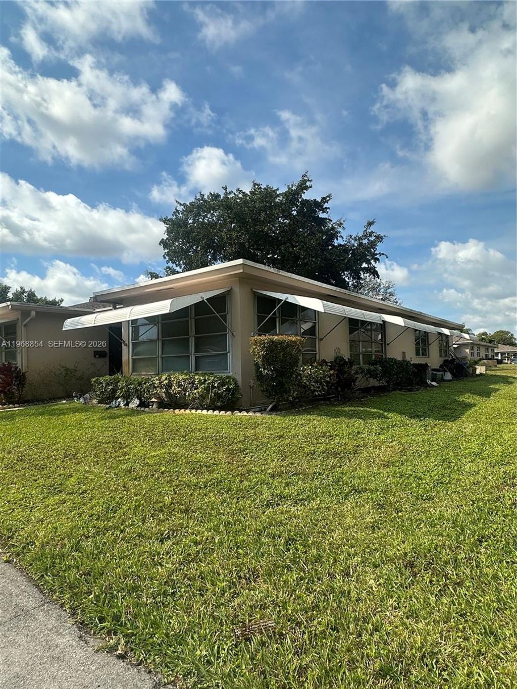 Photo of 1252 W Club Dr W #D, Delray Beach, FL 33445 (MLS # A11968854)